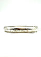 Silver bangle with engraved design on a white background .925 Sterling Silver 10MM Etched Hinged Bangle Bracelet