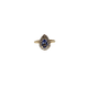 Gold ring with a heart-shaped sapphire stone on a white background