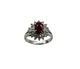 Gold ring with a yellow gemstone on a white background