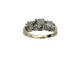 Diamond ring with three circular diamonds on a white background