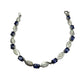 .925 Sterling Silver White Opal Inlay Blue Stone Bracelet Silver bracelet with blue gemstones on a white background