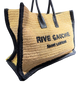 Beige handbag with black text and trim on a white background