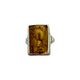 Ring with a detailed design of a face on a white background