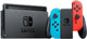 Nintendo Switch w/ Joy-Cons & Dock (HAC-001) Nintendo Switch console and Joy-Con controllers in black, blue, and red.