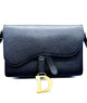 Black handbag with a gold 'D' emblem on a white background
