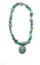 Carolyn Pollack .925 Sterling Silver Turquoise Bead Framed Oval Pendant Necklace Turquoise beaded necklace with a pendant on a white background