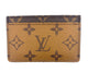 Louis Vuitton wallet with monogram pattern on a white background