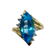 14K Yellow Gold Blue Topaz Marquise Diamond Accent Bypass Ring Gold ring with a large blue gemstone and smaller diamonds on a white background