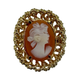 18K Yellow Gold Twisting Rope Framed Pink and White Cameo Ring Gold-framed cameo brooch with intricate design on a white background