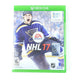 Xbox One game console with NHL 17 cover featuring a hockey player in a blue uniform.