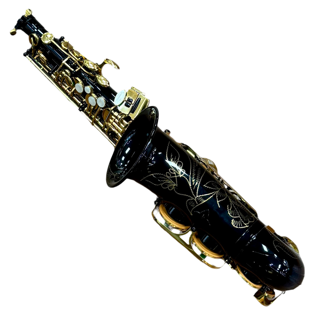 SLADE Eb Alto Saxophone w/ Case & Accessories Black and gold saxophone with intricate designs on a white background