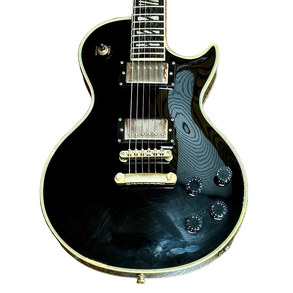 Gibson Les Paul Supreme Electric Guitar w/ Hard Case Black electric guitar with gold hardware on a white background