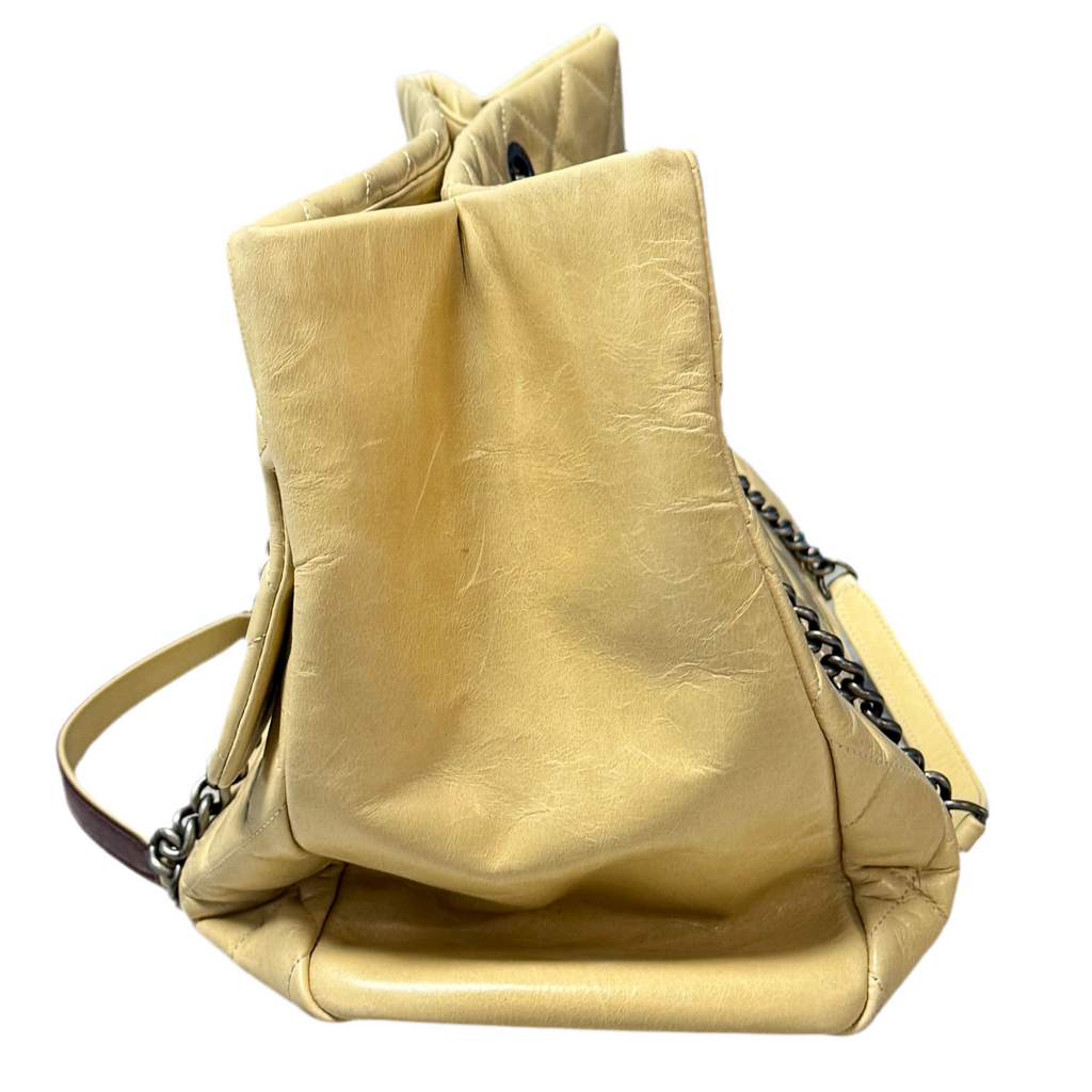 CHANEL Glazed Calfskin Leather Quilted Small Duo Color Tote Bag - Beige leather handbag with chain detail on a white background