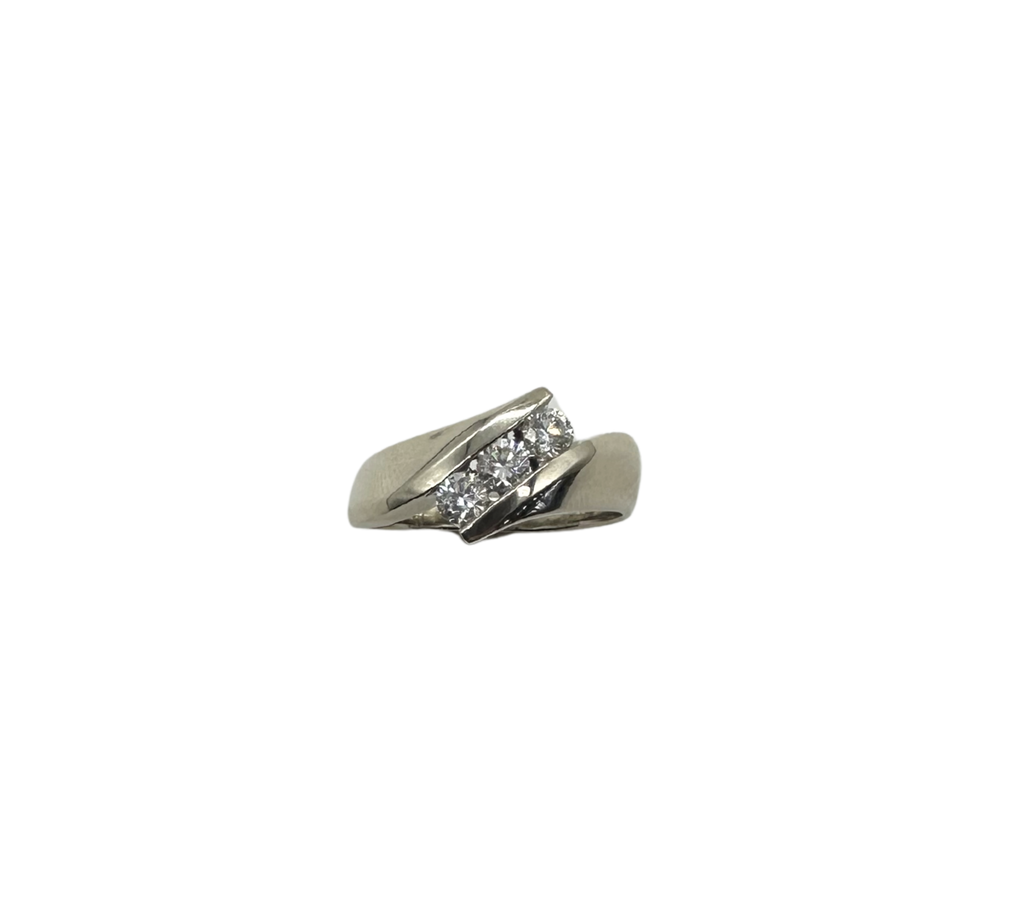 Silver ring with diamonds on a white background