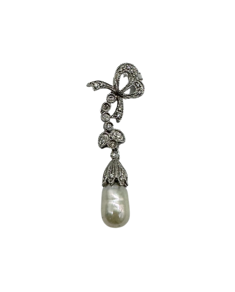 Decorative pendant with bow and pearl on a white background