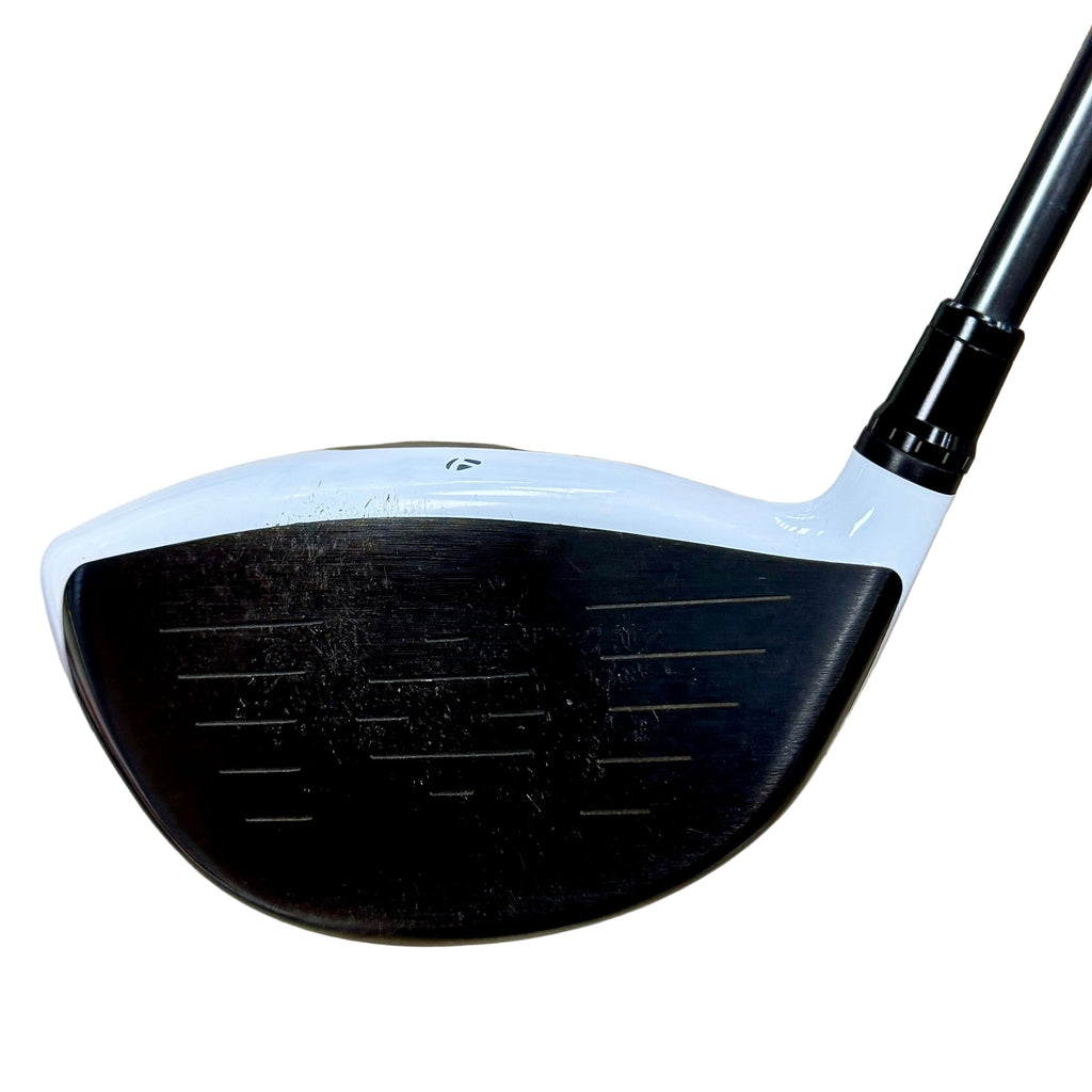 TaylorMade M2 9.5-Degree Driver RH Golf Club Close-up of a golf club head on a wooden surface