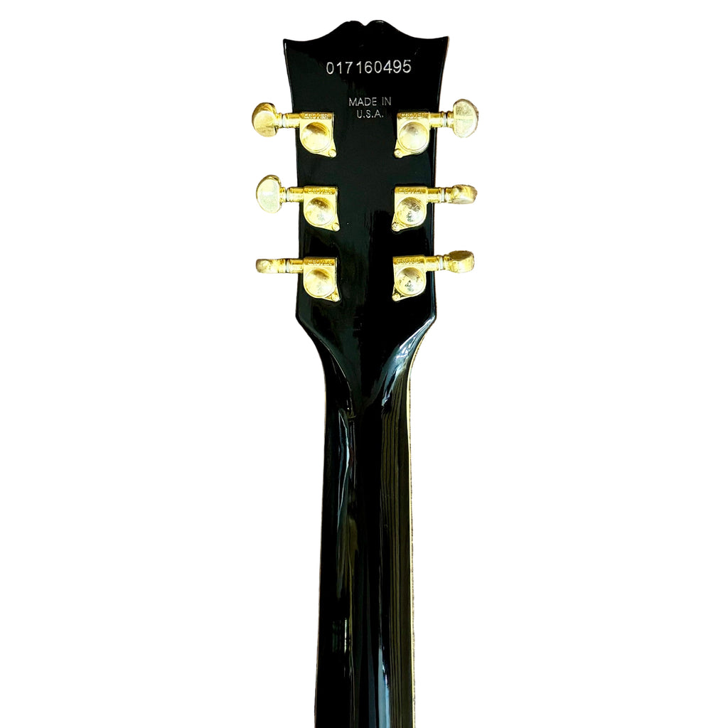 Gibson Les Paul Supreme Electric Guitar w/ Hard Case Guitar headstock with tuning pegs on a white background