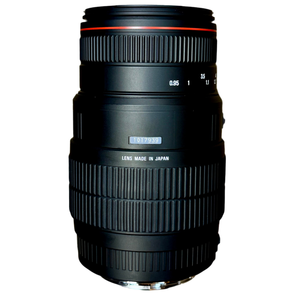 SIGMA 70-300mm f/4-5.6 APO Camera Lens w/ Caps & Case (Canon AF) Camera lens with 'Made in Japan' text on a white background