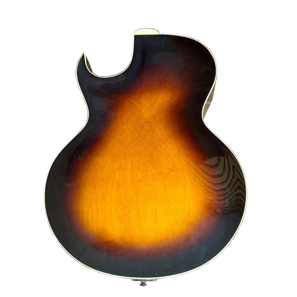 The Loar LH-280-CSN Hollow Body Electric Guitar Electric guitar with sunburst finish on a wooden floor