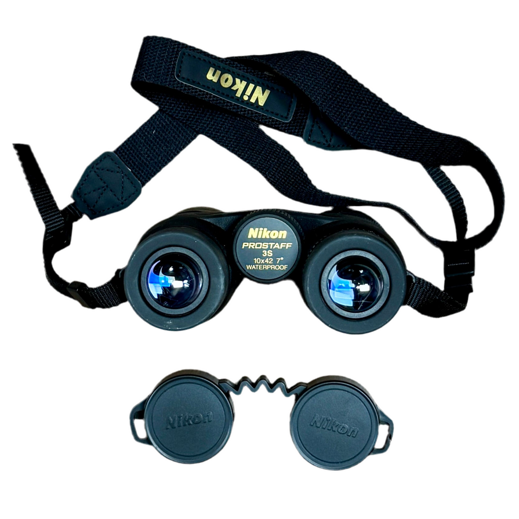 Nikon PROSTAFF 3S 10x42 7-Degree Waterproof Binoculars w/ Case & Caps Nikon binoculars with a strap on a white background