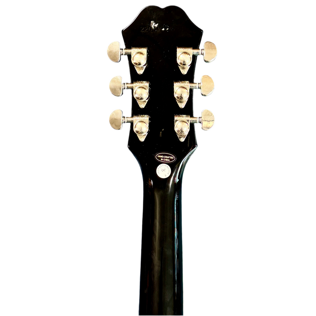 Epiphone DC PRO Electric Guitar Close-up of a black guitar headstock with tuning pegs on a white background