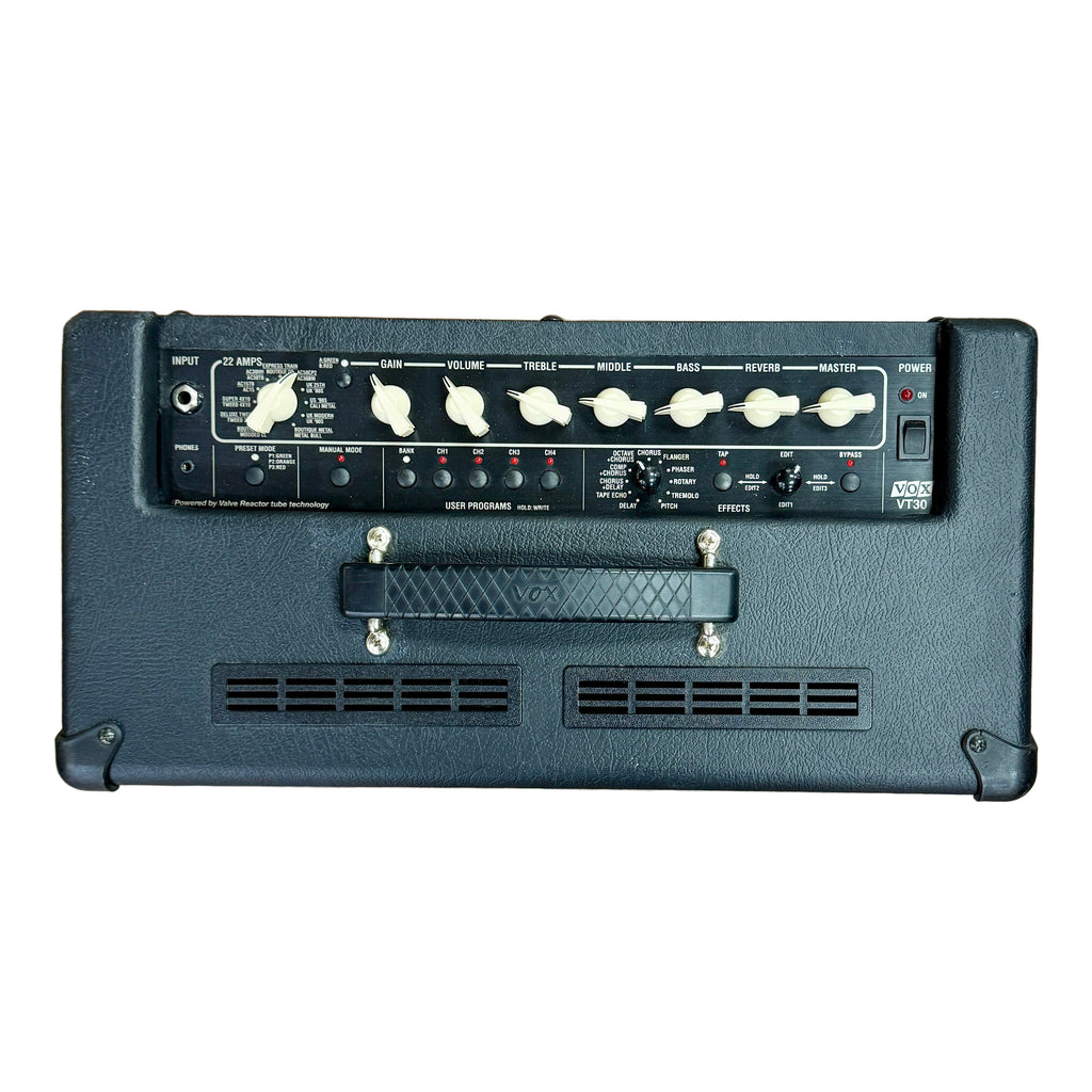 VOX Valvetronix VT30 Guitar Combo Amplifier Black guitar amplifier on a wooden floor