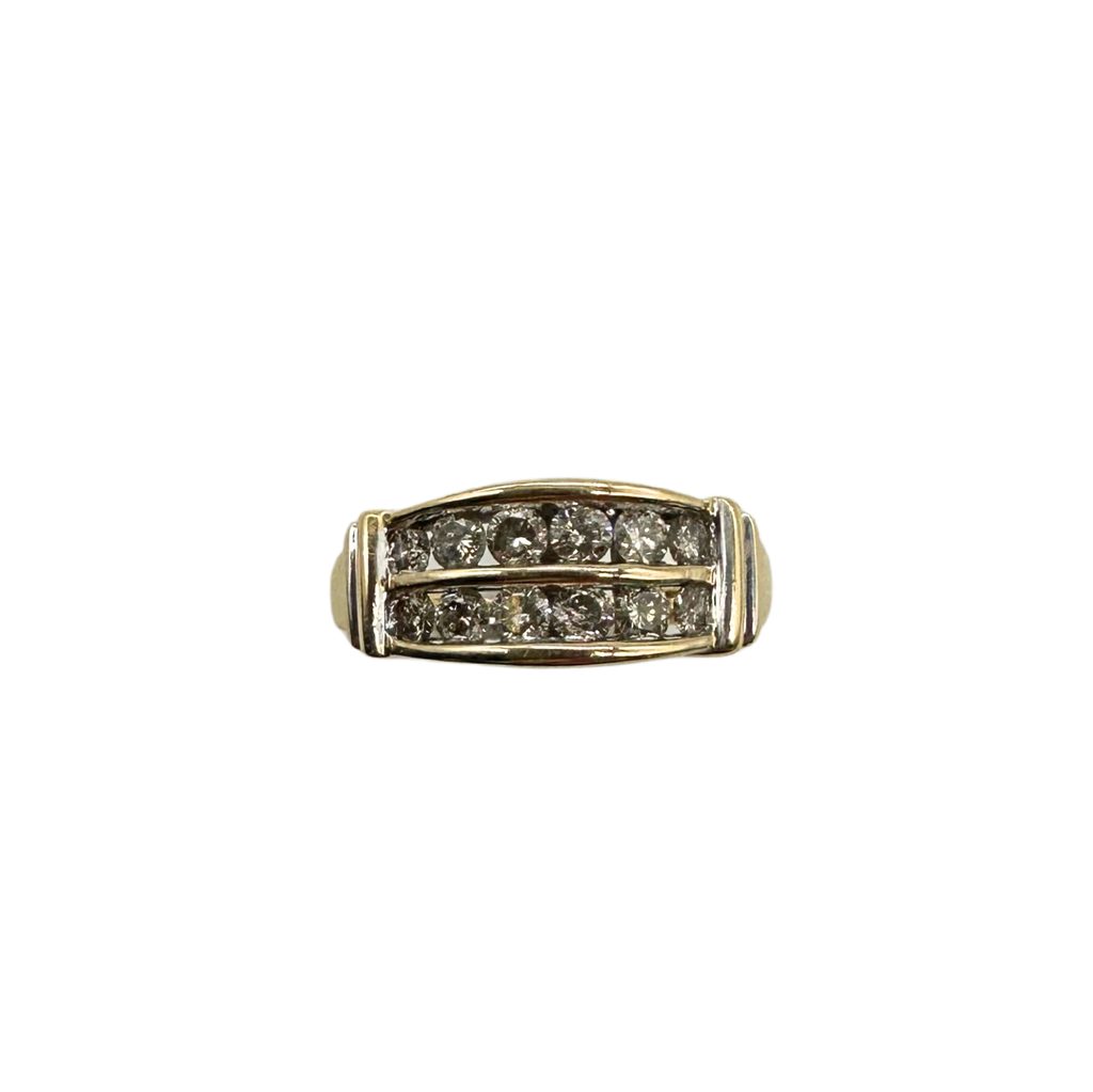 Gold ring with embedded diamonds on a white background