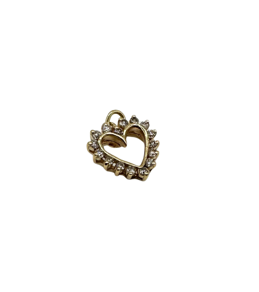 Gold heart-shaped pendant with small stones on a white background