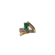 Gold ring with a green gemstone on a white background