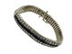 Vintage 14K White Gold 2CTW Diamond and Sapphire 3 Row Snake Bracelet Silver bracelet with blue stones on a white background