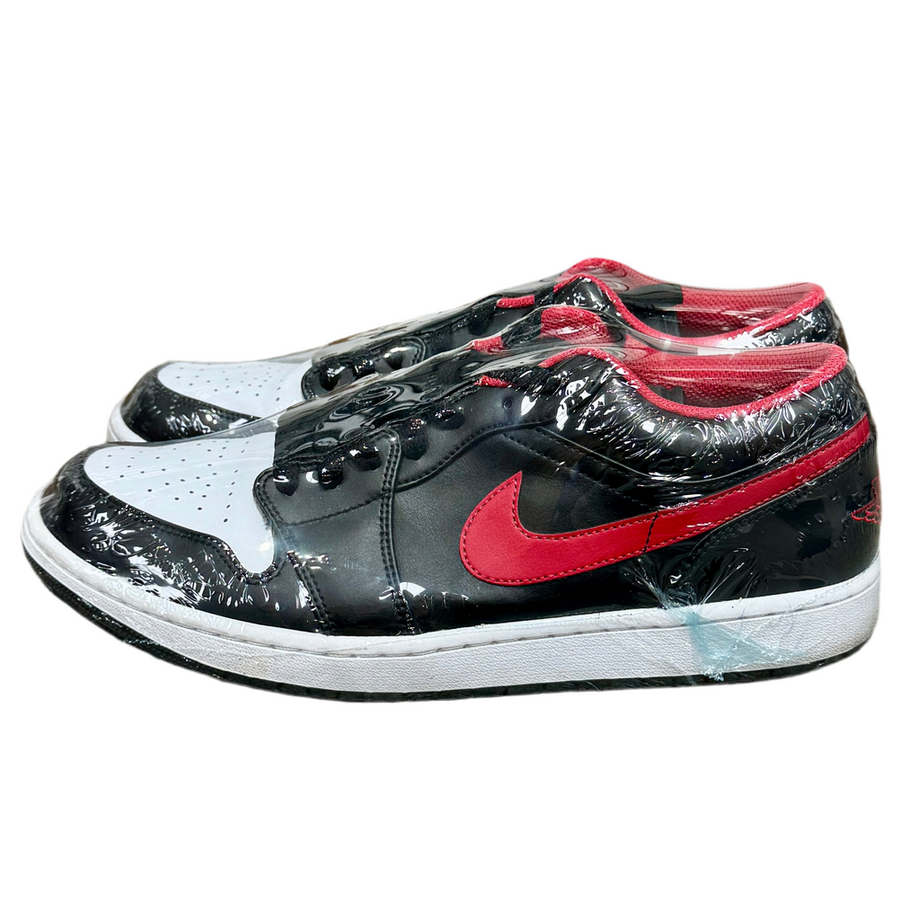Jordan 1 Low - White Toe (Size 12) Black and red sneakers with a clear protective cover on a white background