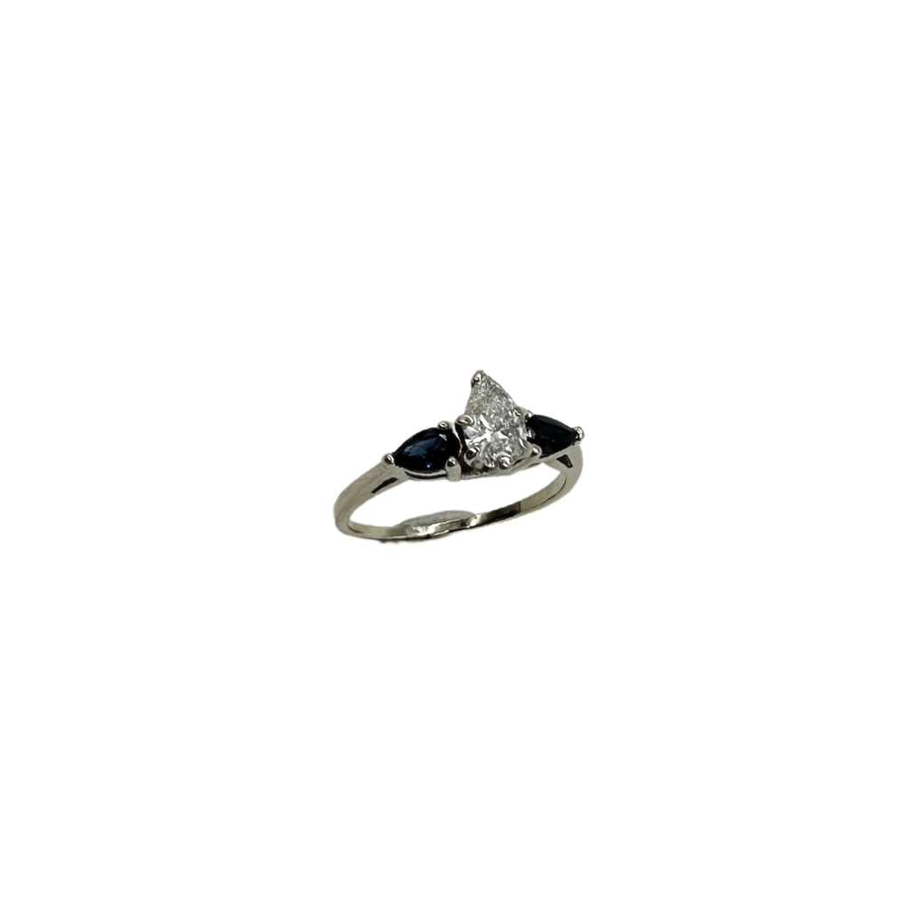 Diamond ring with sapphires on a white background