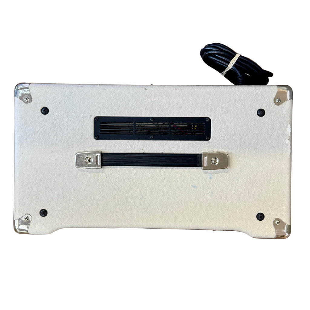 Ibanez TSA30-H Guitar Combo Amplifier Back view of a white electronic device on a wooden floor