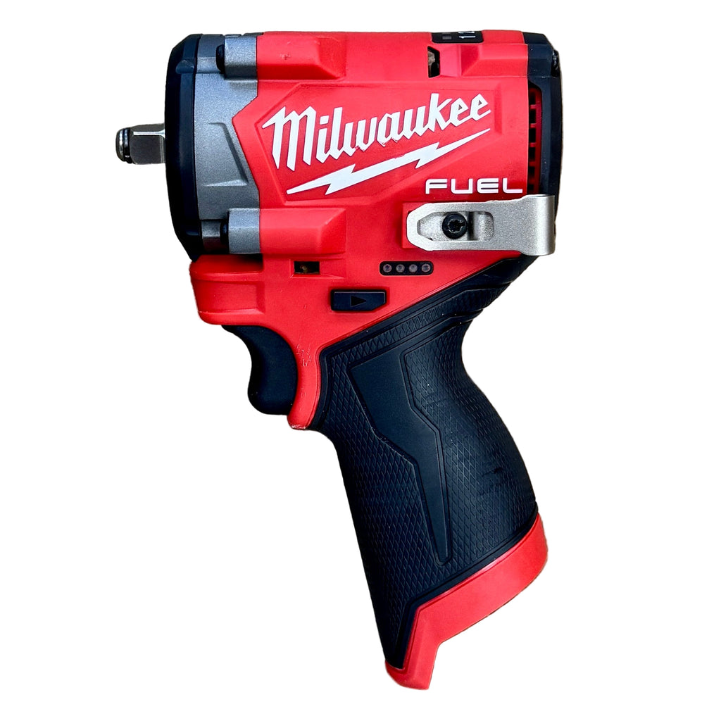 Milwaukee M12 FUEL 12V 3/8" Brushless Cordless Stubby Impact Wrench (2562-20) Red and black Milwaukee power tool on a wooden surface