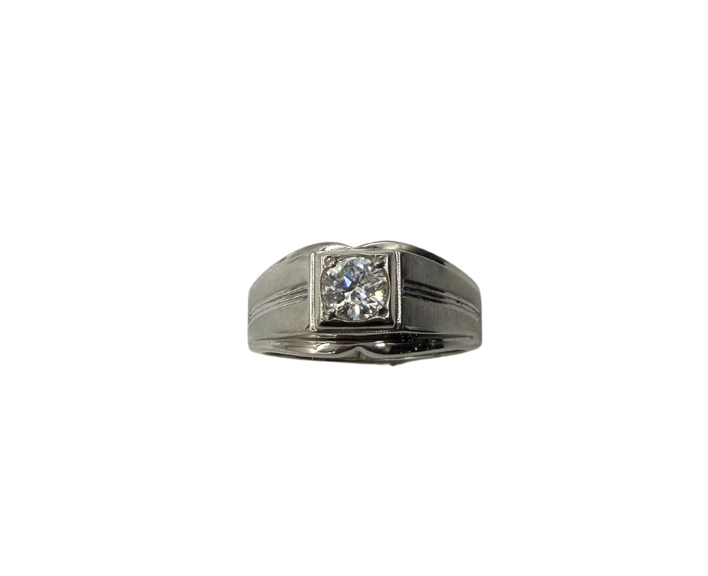 Silver ring with a diamond on a white background