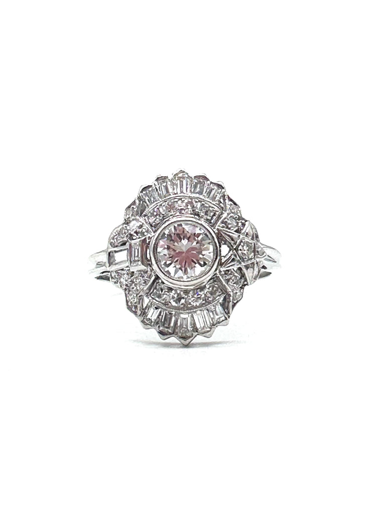 Diamond ring with a pink gemstone on a white background