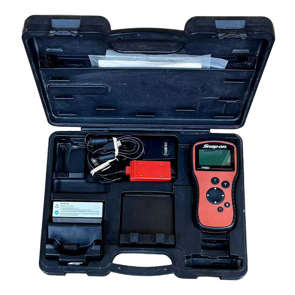 Snap-On Tire Pressure Sensor System Tool w/ Hard Case (TPMS3) Open tool case with electronic devices on a wooden floor