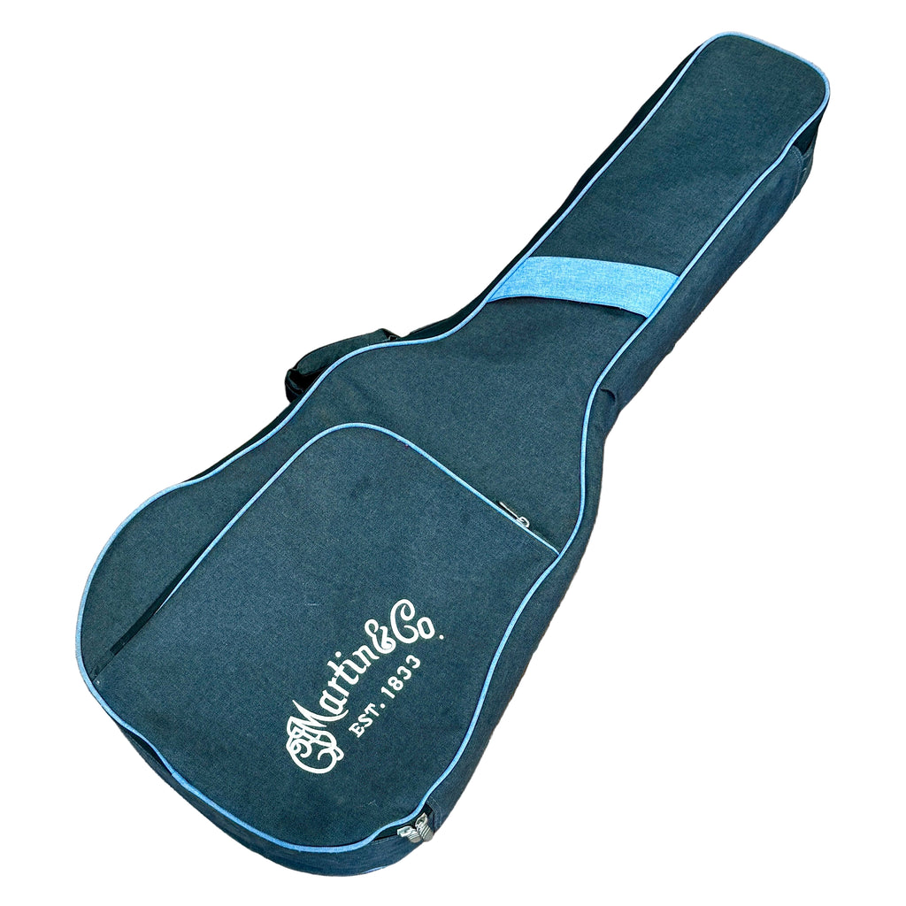Martin Road Series 000-12E Acoustic-Electric Guitar w/ Soft Case Blue guitar case with Martin & Co logo on a white background