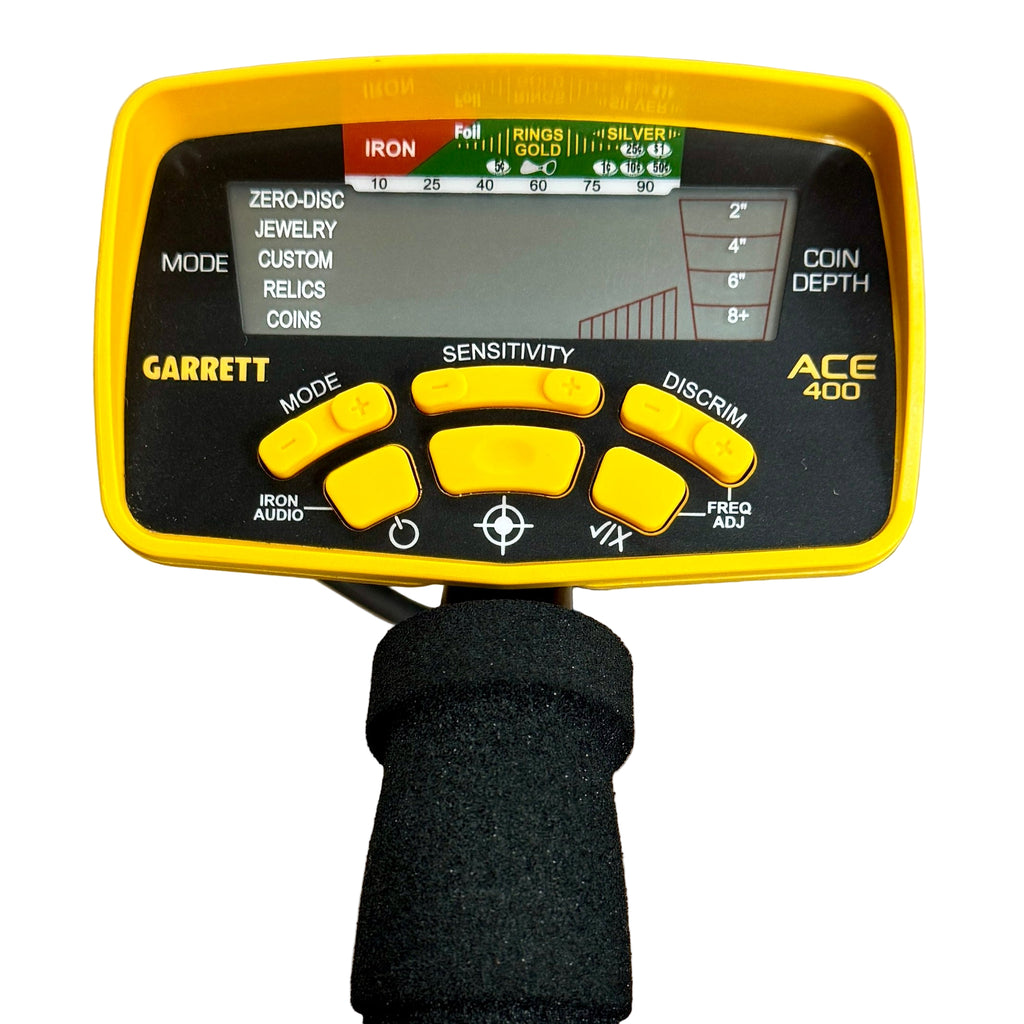Garrett ACE 400 Metal Detector w/ Headphones Garrett ACE 400 metal detector on a wooden surface