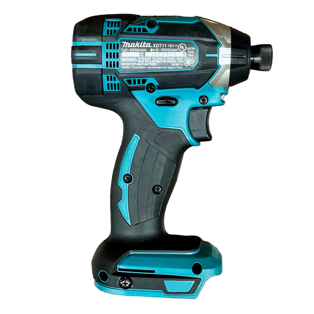 Makita 18V LXT 1/4" Cordless Variable Speed Impact Driver (XDT11) Makita cordless drill on a wooden surface