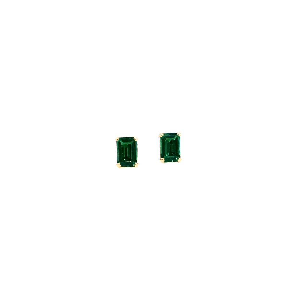 Pair of emerald green square-cut gemstone earrings on a white background