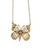 Gold butterfly necklace with gemstones on a white background
