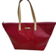 Red handbag with gold accents on a white background