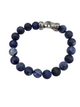 Blue beaded bracelet with a silver clasp on a white background