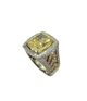Gold ring with a large yellow gemstone on a white background