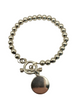 .925 Sterling Silver Beaded Toggle Bracelet W/ Blank Round Charm Silver beaded bracelet with a round tag on a white background