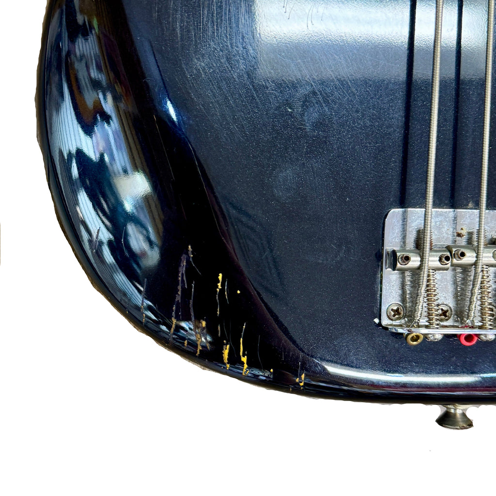 Fender Standard Precision Bass Electric Bass Guitar w/ Hard Case Close-up of a blue electric bass guitar on a white background