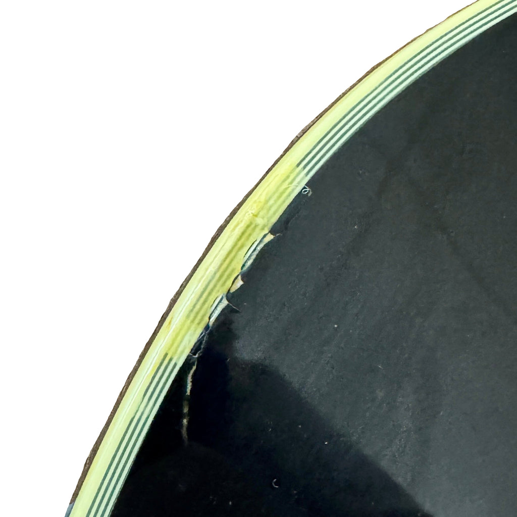 Gibson Les Paul Supreme Electric Guitar w/ Hard Case Close-up of a bicycle tire with a crack on a wooden surface