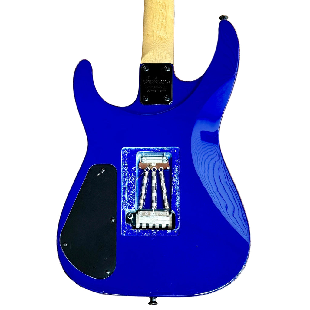 Jackson JS Series Dinky Arch Top JS32Q DKA Electric Guitar w/ Hard Case Blue electric guitar body on a wooden floor