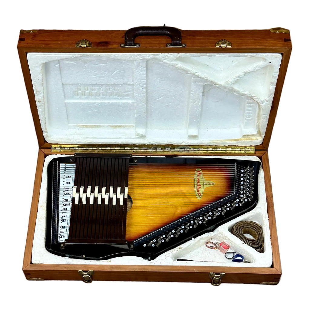 RBI Rhythm Band Inc. ChromAharP Autoharp w/ Hard Case Wooden musical instrument in an open case on a wooden floor.